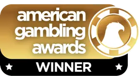A gold and black badge with the text american gambling awards WINNER and an eagle logo on a poker chip.